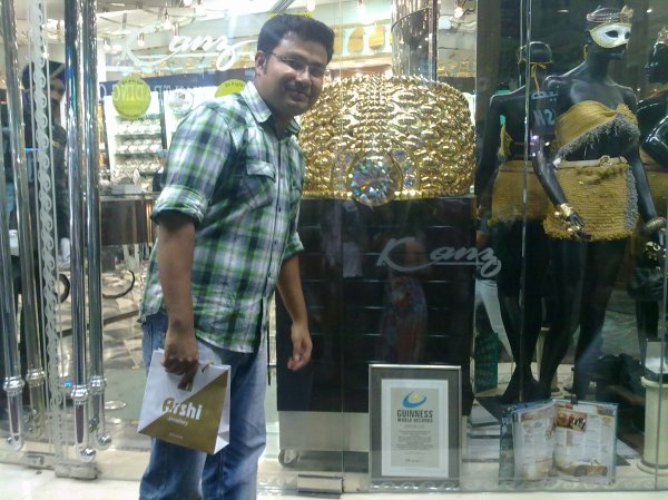 Writer in front of the world`s biggest gold ring in Deira, Dubai.